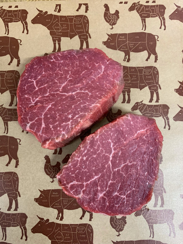 Two raw David Moore's Fillet steaks.