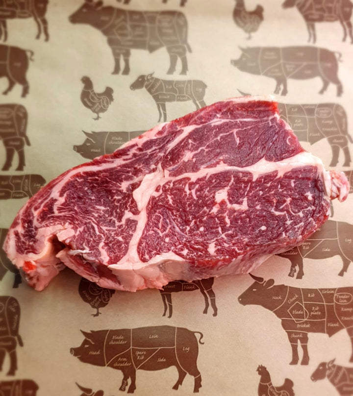 A raw David Moore's rib eye steak.