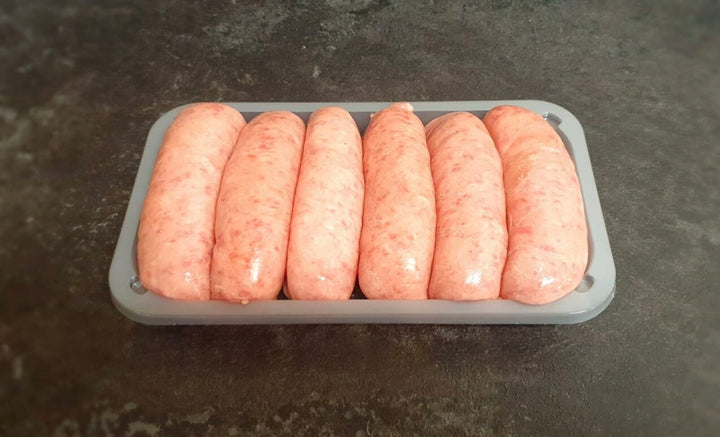 A tray of six raw David Moore's sausage meat.