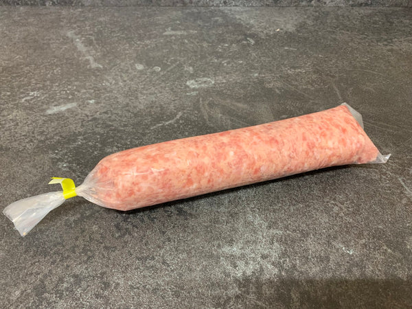 A tube of raw David Moore's sausage meat tightly packed in plastic wrapping.