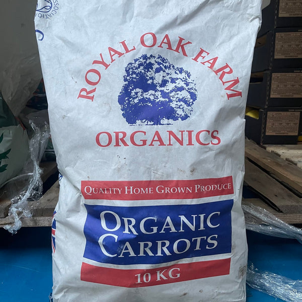 A white paper bag labeled 'Royal Oak Farm Organics' Qualoty Home Grown Produce, Organic Potatoes. Axona Carrots. 10kg.